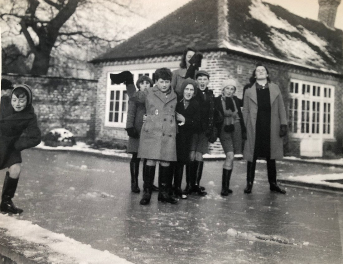 Children playing on a frozen swimming pool