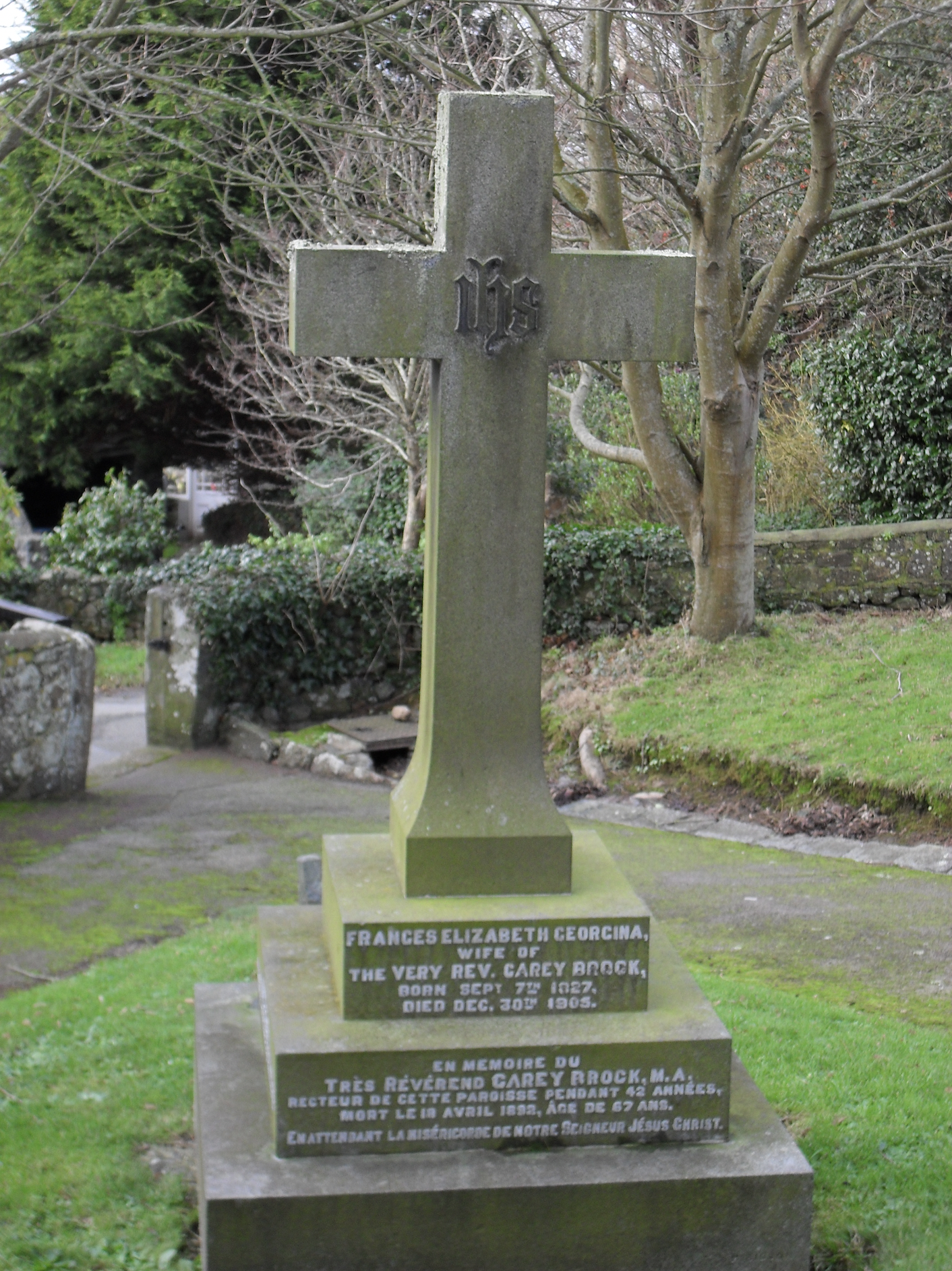 Front of a memorial cross in a Guernsey churchyard
