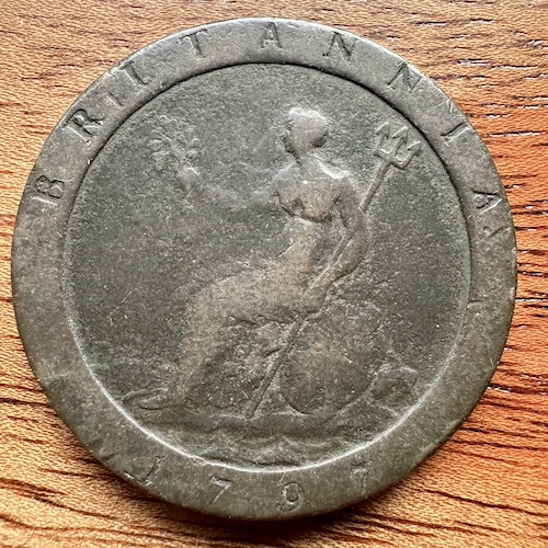 photo of a copper 'cartwheel' penny showing the tail side of Britannia and the year 1797