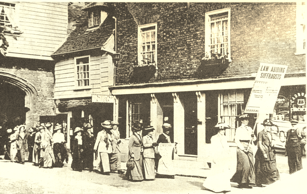 Vera carrying a placard leads a group of women on the Great Pilgrimage 1913 to a service in Rochester Cathedral