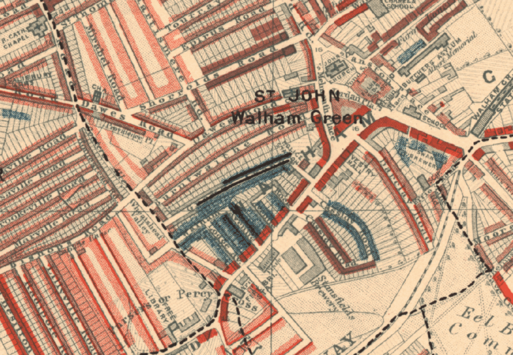 A colour-coded Victorian-era map of Walham Green in West London, showing densely packed streets and housing. The map highlights different social classes by shading: red for middle-class areas, blue for poorer districts, and black for the lowest-income or most deprived areas.  The area marked “St John Walham Green” is near the centre of the image.