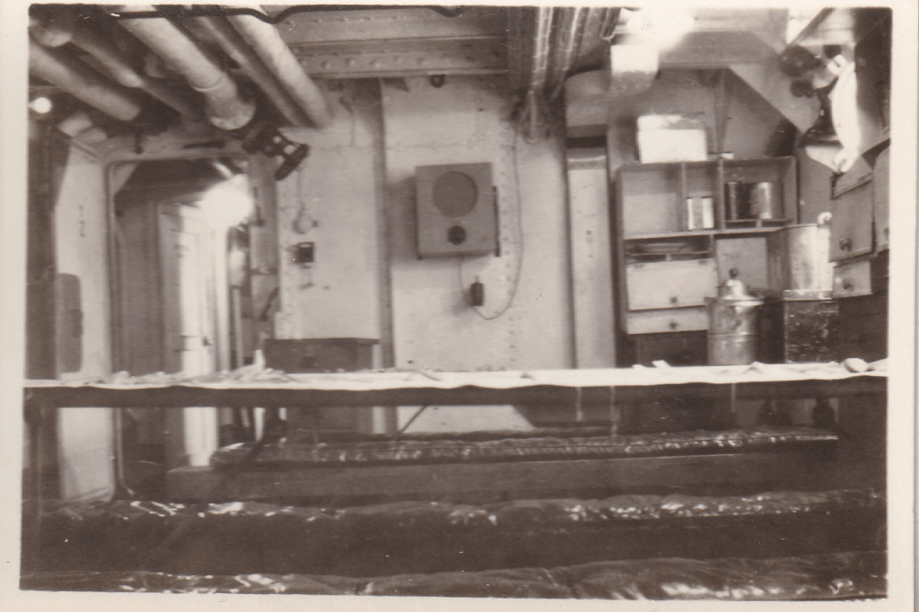 Black and white photograph of a tidy Mess Room aboard HMS Pickle c.1945