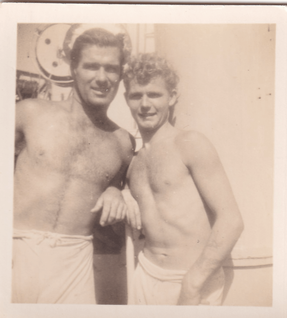 Black and white photograph of two young crew members wearing white shorts aboard HMS Pickle c.1945