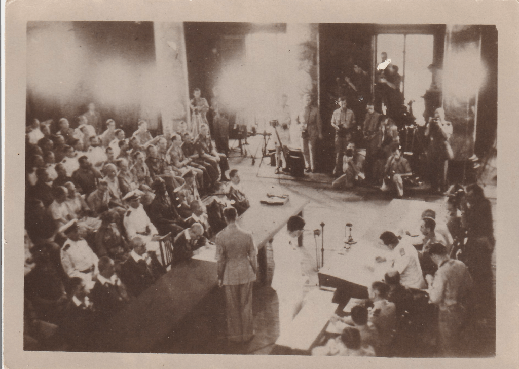 Black and white photograph showing the signing of the formal surrender to Supreme Allied Commander, South East Asia, Admiral Lord Louis Mountbatten by the delgation led by General Itagaki Sheishiro at the Municipal Building, Singapore, on 12 Sep 1945