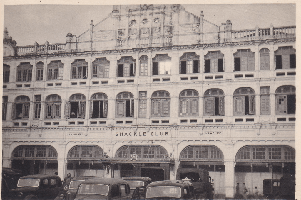 Black and white photograph showing the facade of the Shackle Club for armed forces servicemen, Singapore c.1945
