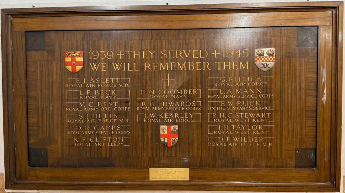 World War II memorial plaque with text listing names and military branches, titled 1939 They Served 1945 We Will Remember Them